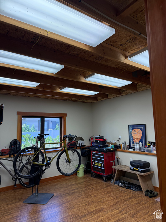 Miscellaneous room with wood finished floors and baseboards