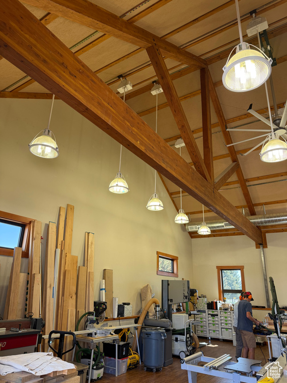 Misc room featuring high vaulted ceiling and beamed ceiling