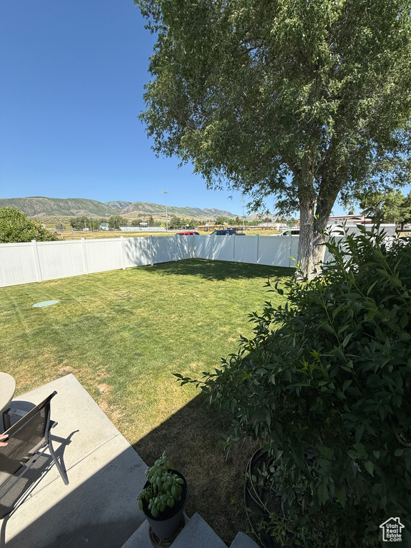 Fenced backyard featuring a patio area