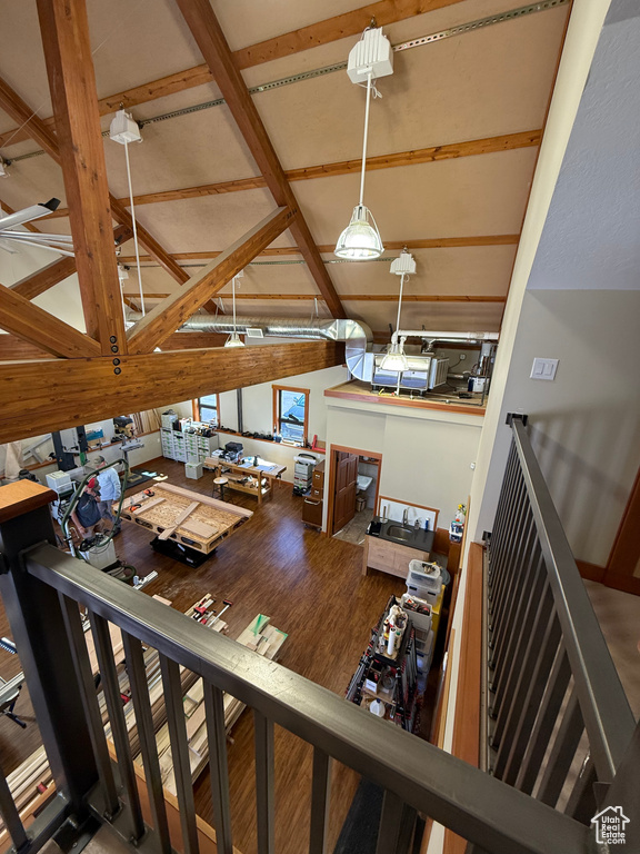 Living room with wood finished floors and lofted ceiling
