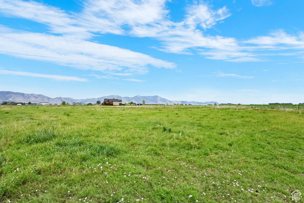 View of yard featuring a view of rural / pastoral area and a mountain view