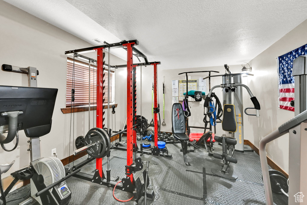 Exercise room featuring a textured ceiling