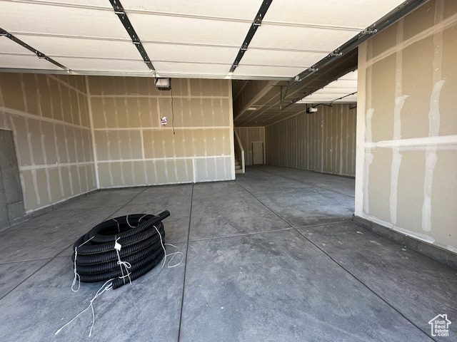 Garage featuring a garage door opener