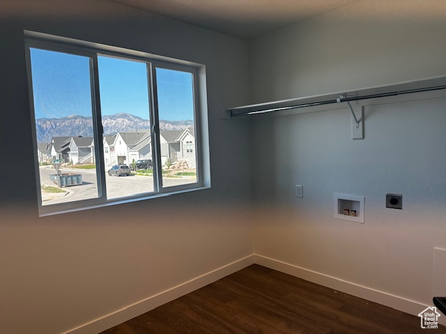Laundry room featuring hookup for an electric dryer, a mountain view, dark wood finished floors, and washer hookup