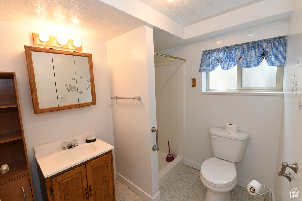 Bathroom with vanity and a shower