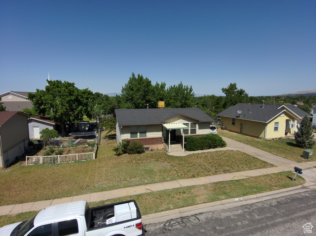 View of front of house with a front lawn and a residential view
