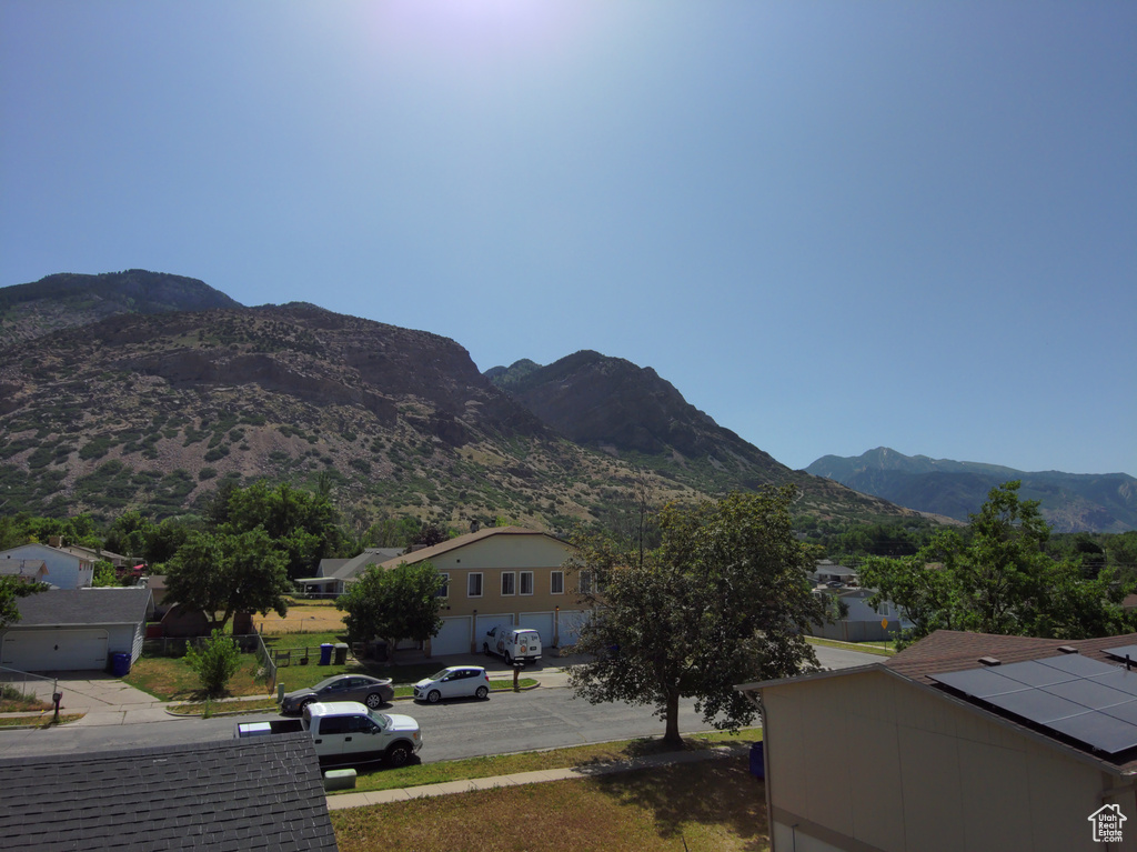 View of mountain backdrop featuring nearby suburban area