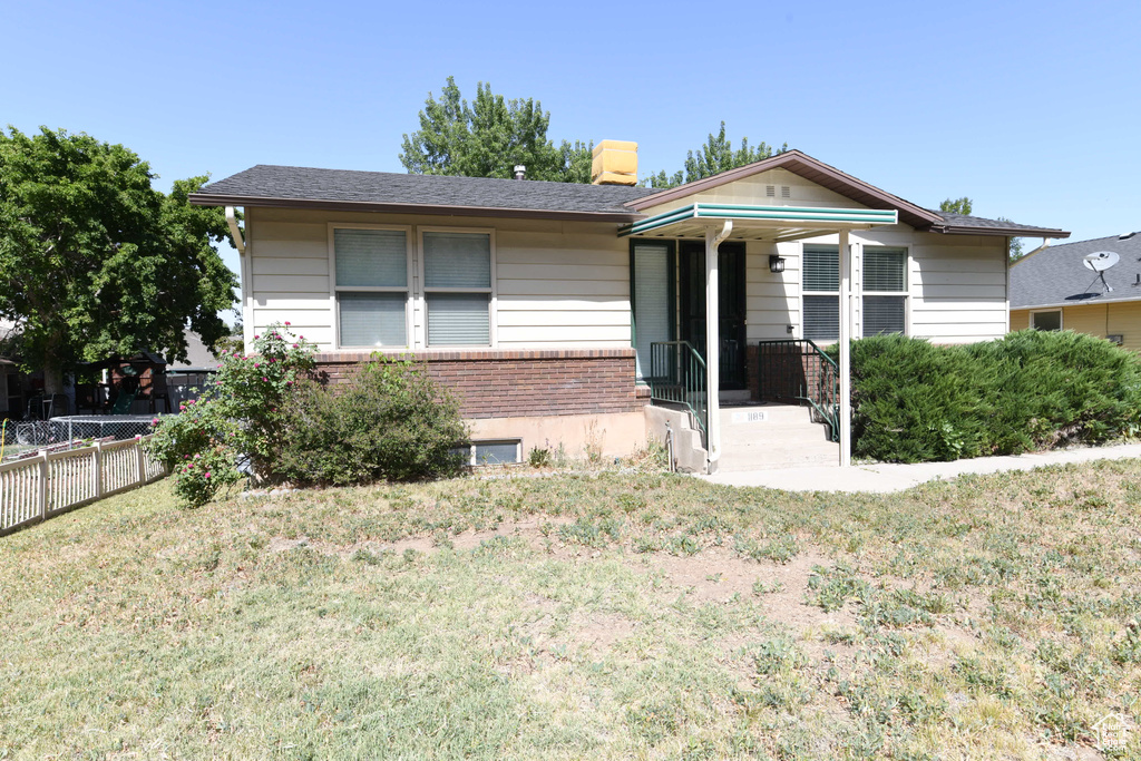 View of front of house with brick siding