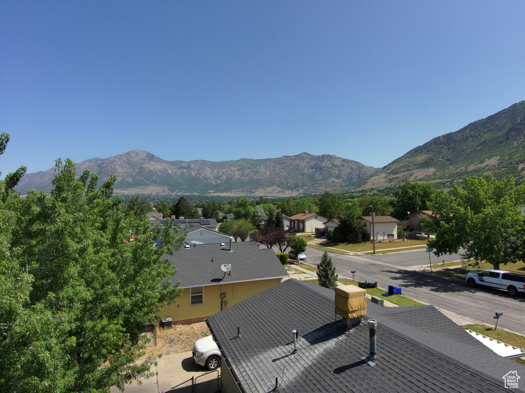 View of mountain background featuring nearby suburban area