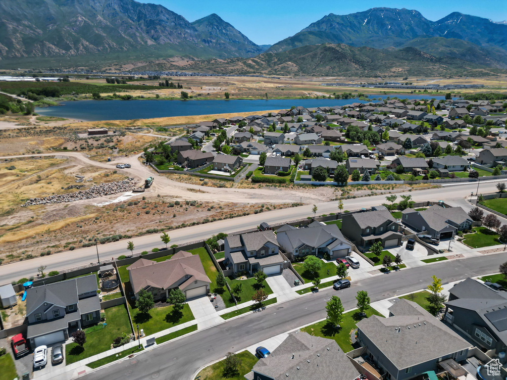 Aerial perspective of suburban area with a water and mountain view