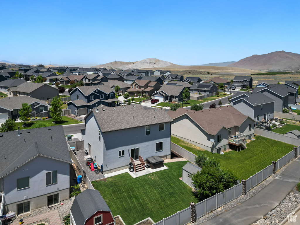 Aerial perspective of suburban area with a mountain backdrop