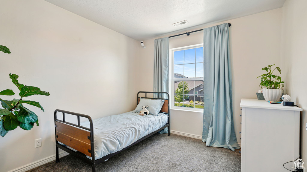 Bedroom with carpet