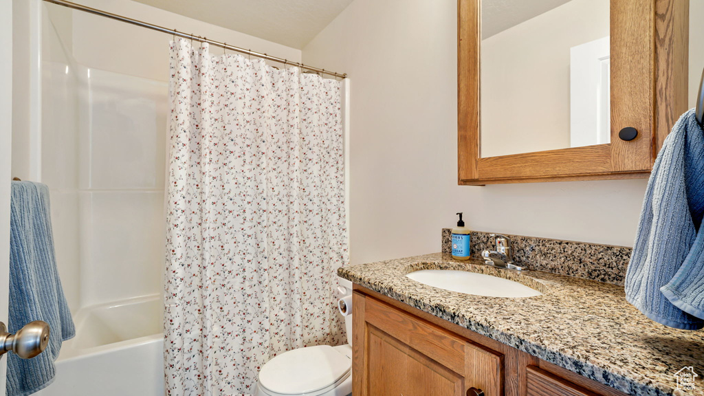 Full bath featuring vanity and shower / bathtub combination with curtain