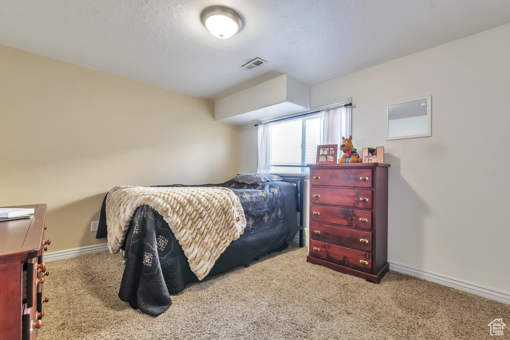 Bedroom featuring carpet