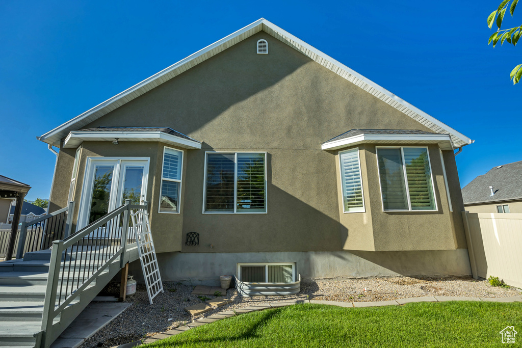 Back of house with stucco siding