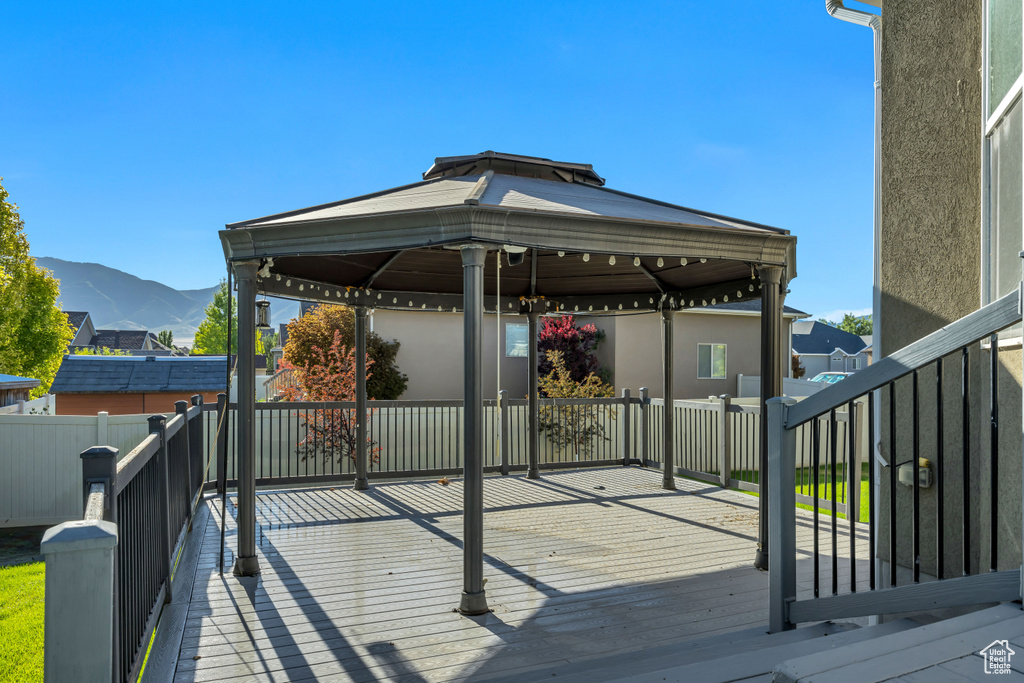 Wooden terrace with a gazebo and a mountain view