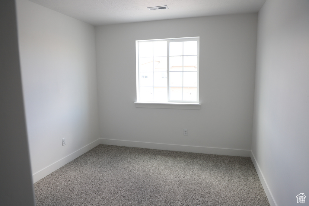 Empty room featuring carpet flooring