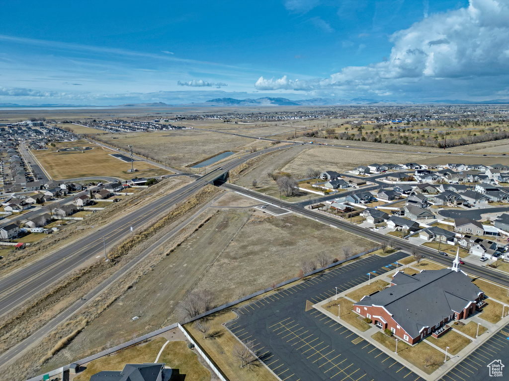 Aerial perspective of suburban area featuring a mountain backdrop