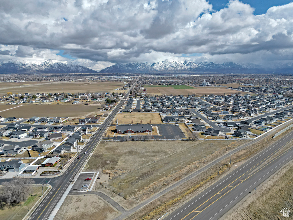 Aerial perspective of suburban area featuring a mountain backdrop