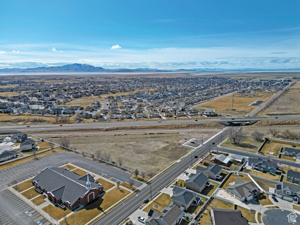 Aerial perspective of suburban area featuring a mountain backdrop