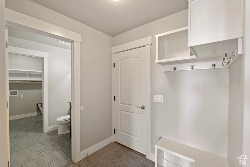 Mudroom featuring baseboards