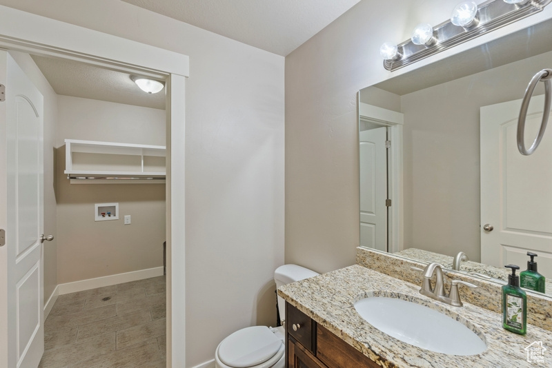 Bathroom with vanity and toilet