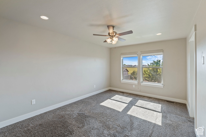 Unfurnished room with carpet, a ceiling fan, and recessed lighting