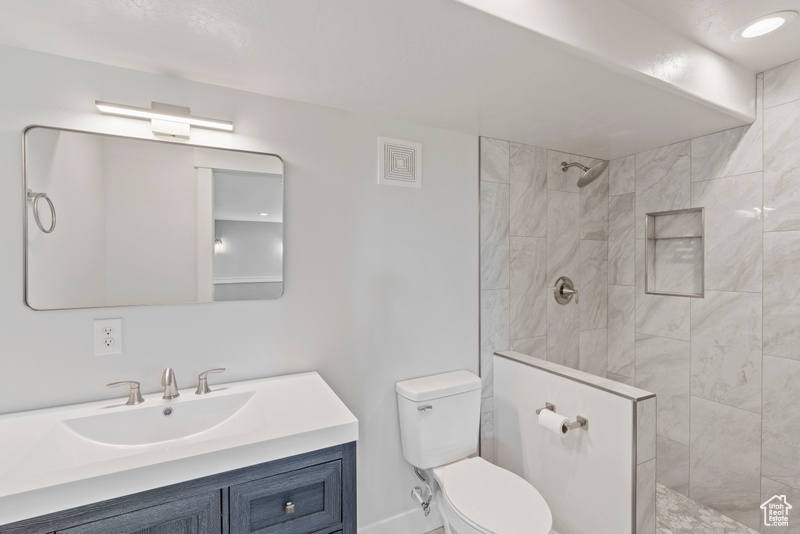 Bathroom with walk in shower and vanity