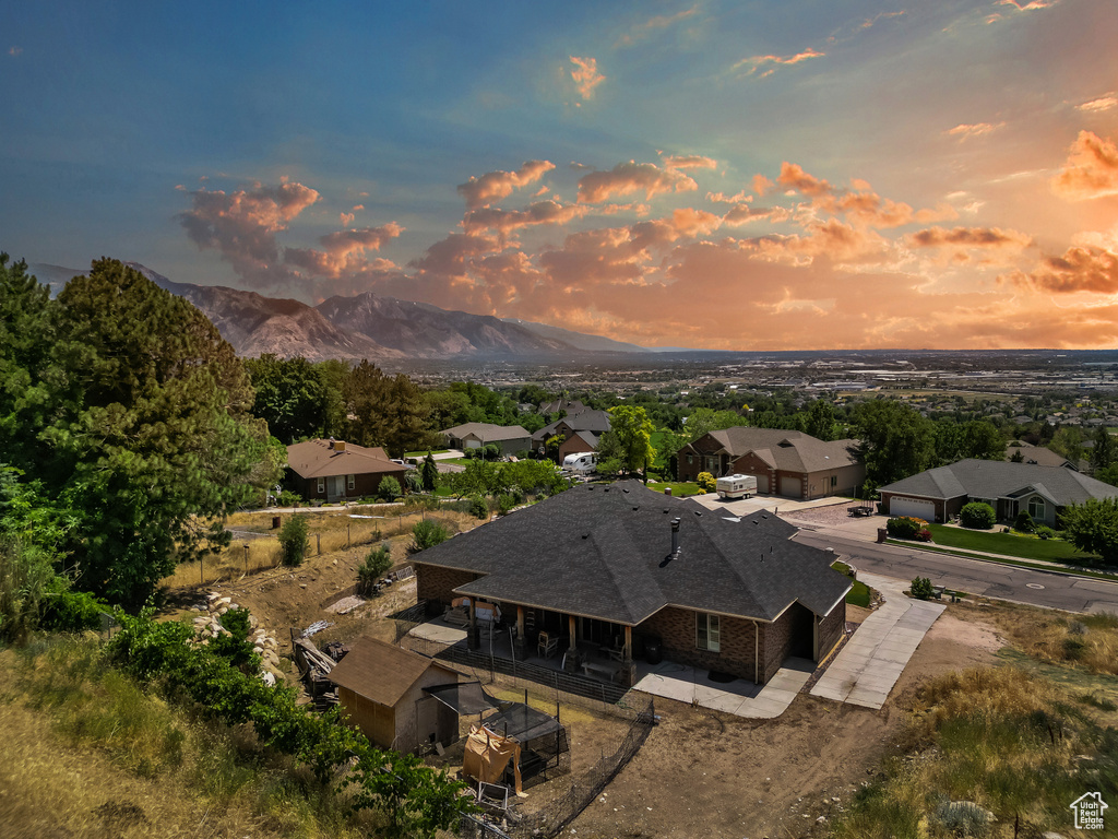 Aerial view of property and surrounding area with mountains