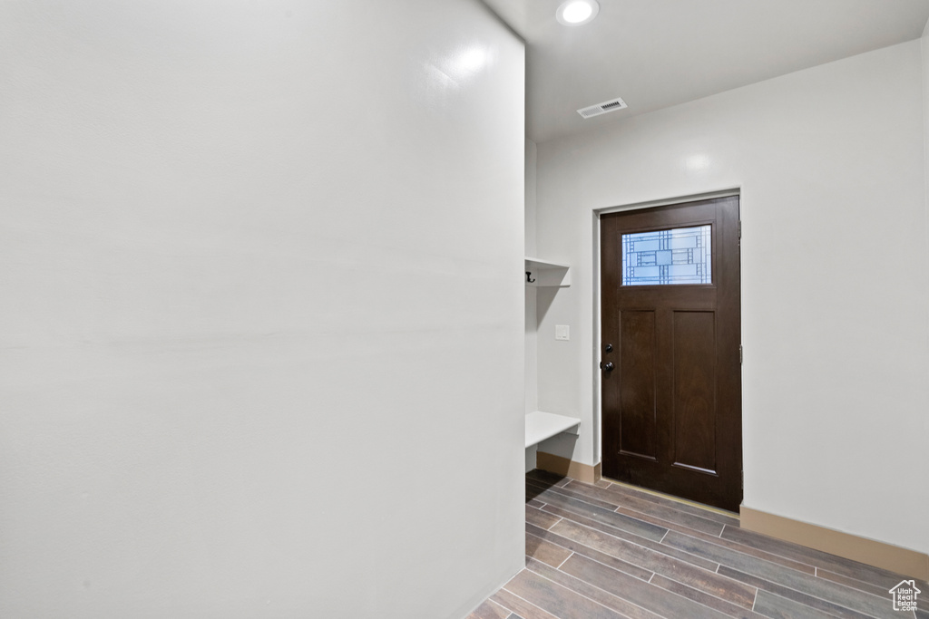 Entryway featuring wood tiled floors and recessed lighting