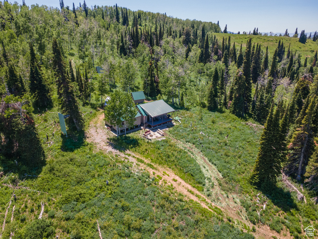 View from above of property with a heavily wooded area