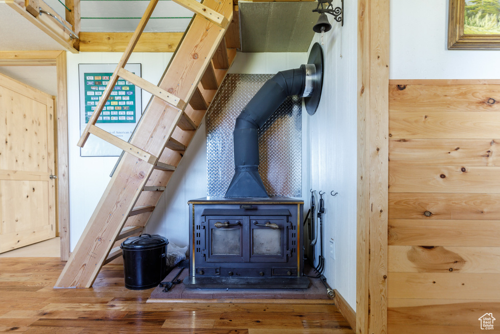 Detailed view of a wood stove and wood finished floors