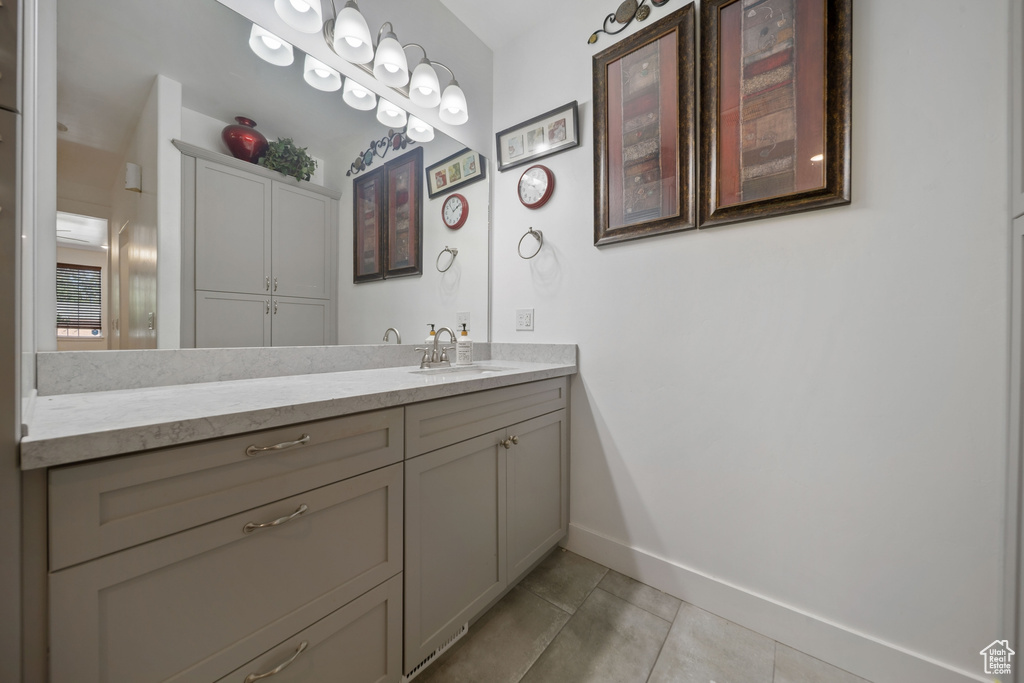 Bathroom featuring tile patterned flooring and vanity