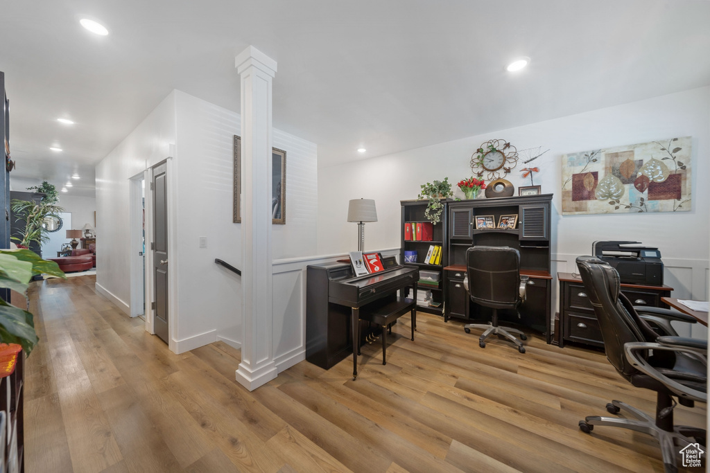 Home office featuring light wood-style floors and recessed lighting