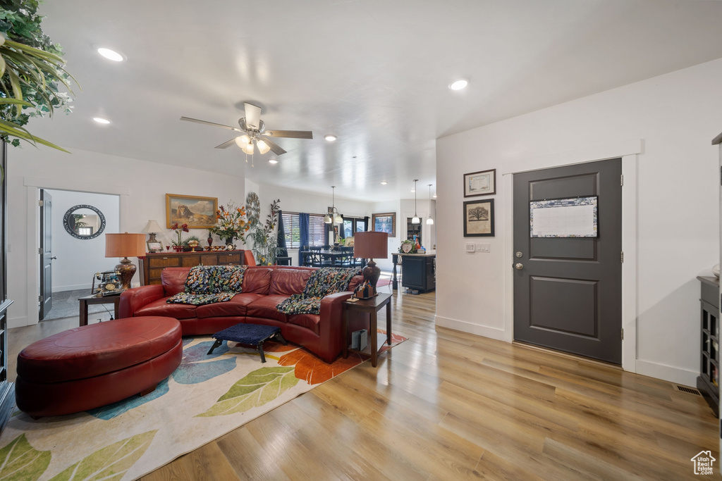 Living area featuring ceiling fan, recessed lighting, and light wood-type flooring