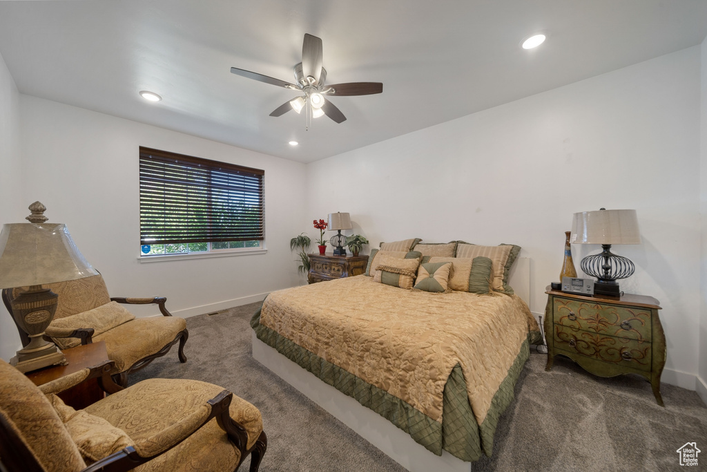 Carpeted bedroom with recessed lighting and ceiling fan
