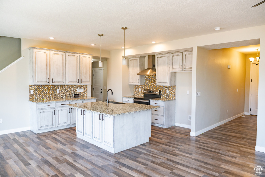 Kitchen featuring stainless steel electric stove, wall chimney range hood, dark wood-style floors, tasteful backsplash, and recessed lighting