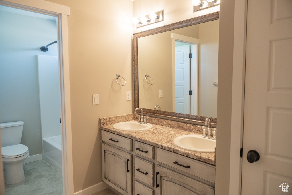 Full bath featuring double vanity and  shower combination