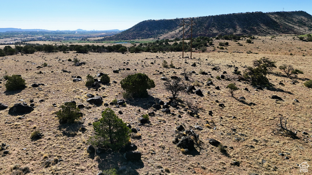 View of mountain backdrop featuring a desert landscape