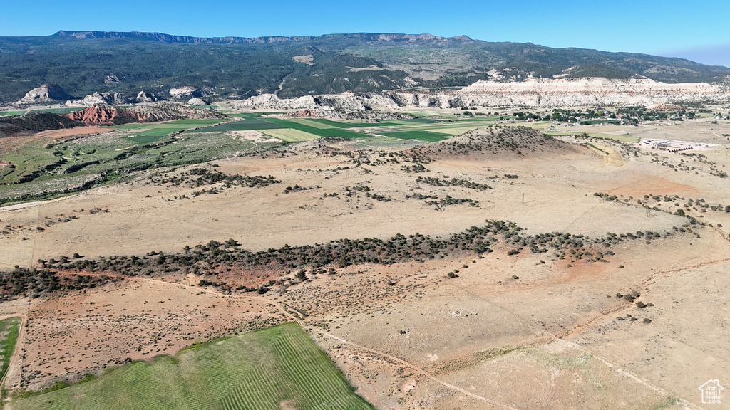 Aerial view of sparsely populated area featuring a mountain backdrop