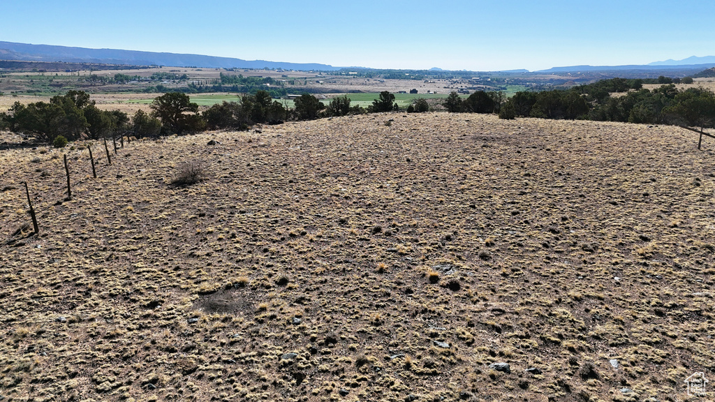 View of mountain backdrop featuring rural landscape