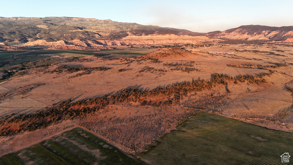 View of mountain backdrop with rural landscape