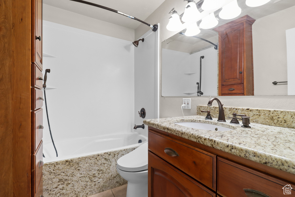 Full bathroom featuring vanity, bathtub / shower combination, a chandelier, and tile patterned floors