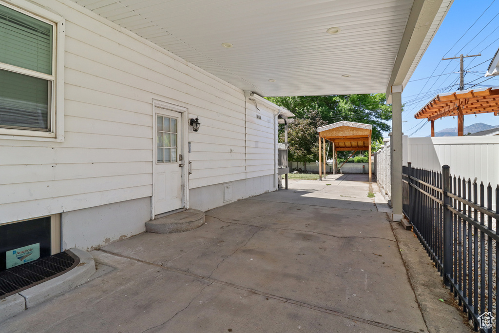 View of patio / terrace featuring a carport