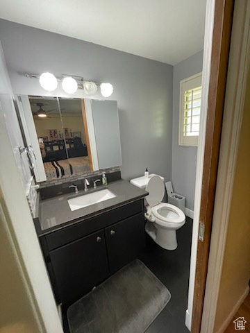 Bathroom featuring vanity and a ceiling fan