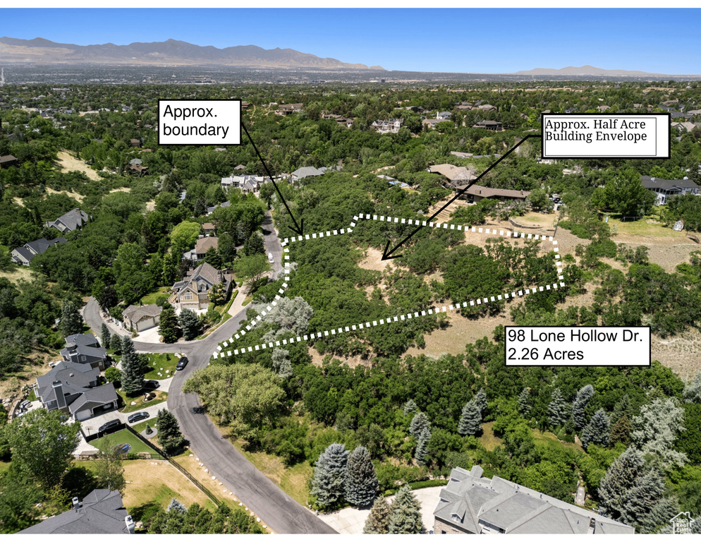 Aerial view of residential area with mountains