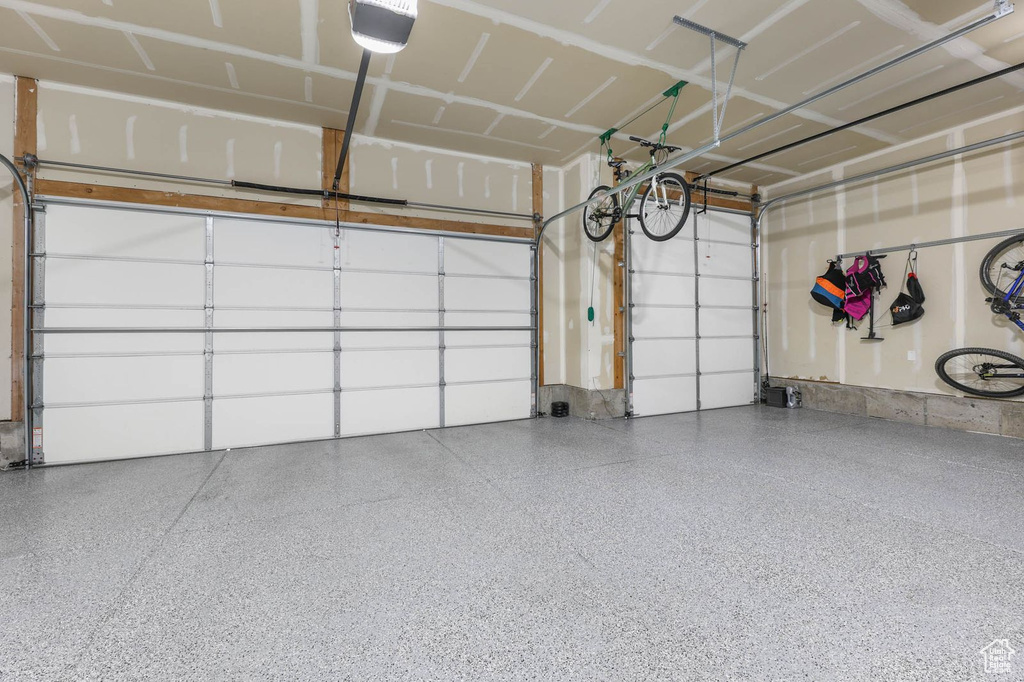 Garage featuring a garage door opener