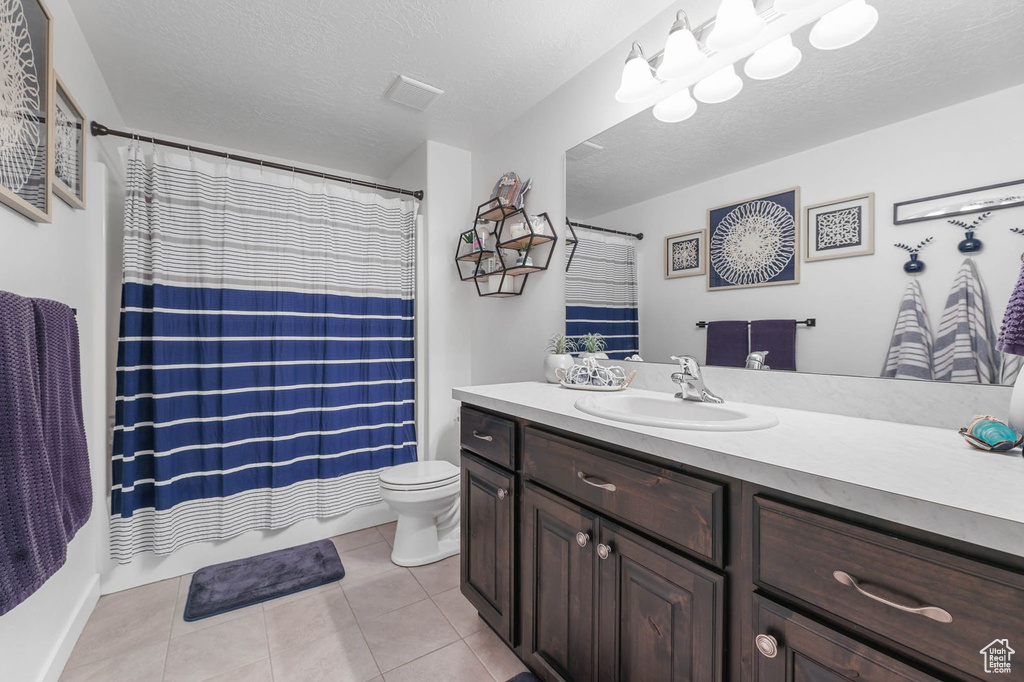 Bathroom featuring vanity and tile patterned floors