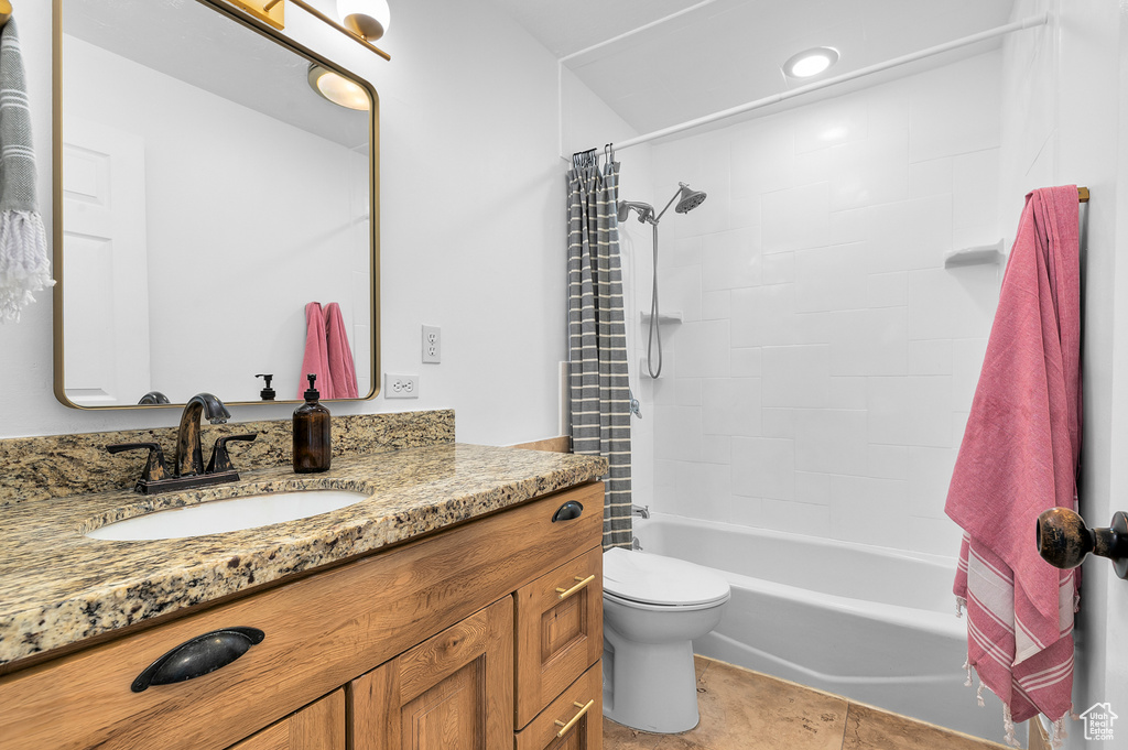 Bathroom with vanity and shower / bathtub combination with curtain