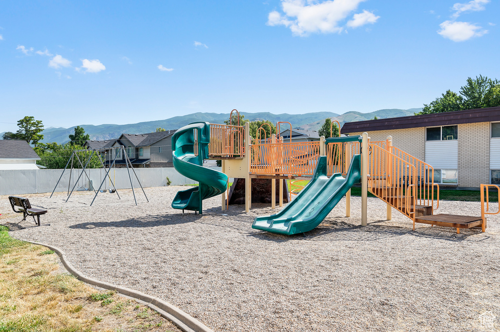 Communal playground featuring a mountain view